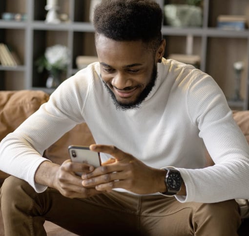 A guy texting on his mobile